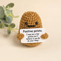 Positive Potato crochet desk buddy holding a pep-talk card